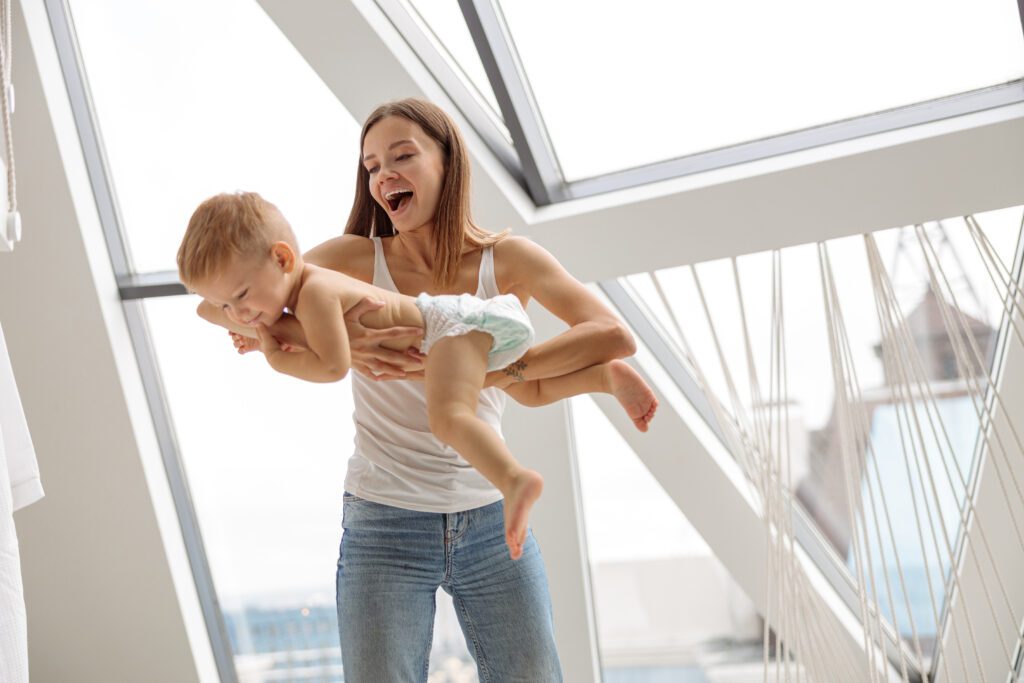 Happy caucasian mother playing with her son indoor 2021 12 23 00 22 15 utc