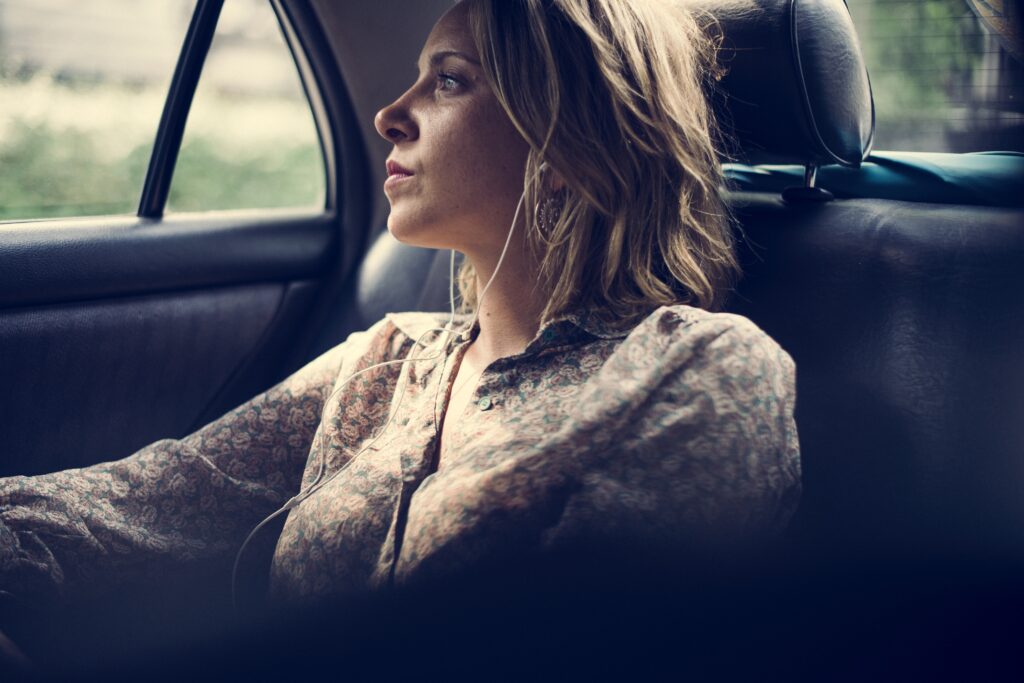 Blond woman sitting in a taxi 2022 12 15 23 12 03 utc